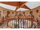 Circular upper landing with a grand chandelier and unique decor at 14502 Scotch Pine Ct, Orlando, FL 32832