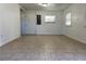 Simple living room with tiled floors and white walls at 14719 Micah St, Winter Garden, FL 34787