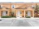 Three-unit building exterior with parking at 2604 Roadster Ln, Kissimmee, FL 34746