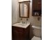 Clean bathroom with a vanity, toilet, and a medicine cabinet at 2902 Calumet Dr, Orlando, FL 32810