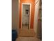 Bathroom with toilet and orange painted walls at 2902 Calumet Dr, Orlando, FL 32810