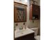 Clean bathroom with a vanity, toilet, and a medicine cabinet at 2902 Calumet Dr, Orlando, FL 32810