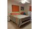 Bedroom with a bed, orange curtains and tile floors at 2902 Calumet Dr, Orlando, FL 32810