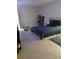 Bedroom with a bed, rugs, and shoe storage at 2902 Calumet Dr, Orlando, FL 32810