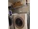 Laundry room with washer, dryer, and shelving at 2902 Calumet Dr, Orlando, FL 32810