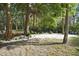 Relaxing backyard with shaded seating area and lush landscaping at 300 Spring Run Cir, Longwood, FL 32779