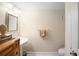 Bathroom with pedestal sink, toilet and mirror at 300 Spring Run Cir, Longwood, FL 32779