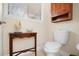 Small bathroom with toilet and wooden vanity at 300 Spring Run Cir, Longwood, FL 32779