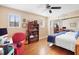 Bedroom with hardwood floors, built-in shelving, and a mirrored closet at 300 Spring Run Cir, Longwood, FL 32779