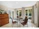 Breakfast room with glass table and French doors leading outdoors at 300 Spring Run Cir, Longwood, FL 32779