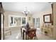 Elegant dining area with bay window and French doors at 300 Spring Run Cir, Longwood, FL 32779