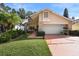 Beautiful home with landscaping, a large driveway and two car garage at 300 Spring Run Cir, Longwood, FL 32779