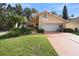 Attractive home with a manicured lawn and spacious driveway at 300 Spring Run Cir, Longwood, FL 32779