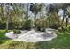 Landscaped garden with potted plants and decorative accents at 300 Spring Run Cir, Longwood, FL 32779
