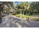 Gated community entrance with guard house and lush landscaping at 300 Spring Run Cir, Longwood, FL 32779