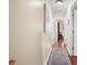 Bright hallway with hardwood floors and neutral walls at 300 Spring Run Cir, Longwood, FL 32779