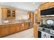 Kitchen with granite countertops, stainless steel appliances, and wood cabinets at 300 Spring Run Cir, Longwood, FL 32779