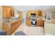 Well-equipped kitchen with wood cabinets and granite countertops at 300 Spring Run Cir, Longwood, FL 32779