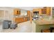 Bright kitchen with granite countertops, stainless steel appliances, and wood cabinets at 300 Spring Run Cir, Longwood, FL 32779