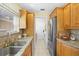 Kitchen with granite countertops, stainless steel appliances, and wood cabinets at 300 Spring Run Cir, Longwood, FL 32779