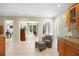 Kitchen with view into Gathering room, granite counters & wood cabinets at 300 Spring Run Cir, Longwood, FL 32779