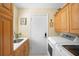 Laundry room with washer, dryer, and cabinets at 300 Spring Run Cir, Longwood, FL 32779