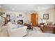 Spacious living room with comfortable seating and fireplace at 300 Spring Run Cir, Longwood, FL 32779