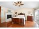 Spacious main bedroom with hardwood floors, a large bed, and fireplace at 300 Spring Run Cir, Longwood, FL 32779