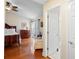 Main bedroom with hardwood floors, large bed, and access to patio at 300 Spring Run Cir, Longwood, FL 32779