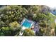 Refreshing community pool surrounded by lush landscaping at 300 Spring Run Cir, Longwood, FL 32779