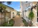 Charming side yard with gravel path, fountain, and plantings at 300 Spring Run Cir, Longwood, FL 32779