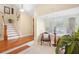 Bright sitting area with two chairs and a large window featuring plantation shutters at 300 Spring Run Cir, Longwood, FL 32779