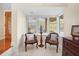 Charming sitting area with two chairs near a window with plantation shutters at 300 Spring Run Cir, Longwood, FL 32779
