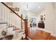Elegant staircase with wood railings and hardwood floors at 300 Spring Run Cir, Longwood, FL 32779