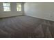 Bright bedroom with plush carpet and large windows at 3800 Sonoma Blvd, Kissimmee, FL 34741