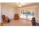Gathering room with sliding doors opening to a patio and pool area at 4272 Kendrick Rd, Orlando, FL 32804