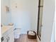 Clean bathroom with white vanity, toilet, and walk-in shower at 4501 S Atlantic Ave # 4090, New Smyrna Beach, FL 32169