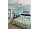 King-size bed and light blue walls in this relaxing bedroom at 4501 S Atlantic Ave # 4090, New Smyrna Beach, FL 32169