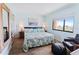 Bright bedroom with king-size bed and ocean view at 4501 S Atlantic Ave # 4090, New Smyrna Beach, FL 32169