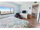 Bedroom with water view, large bed, and ample closet space at 4501 S Atlantic Ave # 4090, New Smyrna Beach, FL 32169