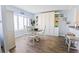 Dining area with a round table and chairs, near kitchen and built-in cabinets at 4501 S Atlantic Ave # 4090, New Smyrna Beach, FL 32169