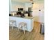 Kitchen with stainless steel appliances and white cabinets at 4501 S Atlantic Ave # 4090, New Smyrna Beach, FL 32169