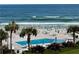 Oceanfront community pool with beach access and ample seating at 4501 S Atlantic Ave # 4090, New Smyrna Beach, FL 32169