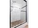 Updated shower with marble tile and sliding glass door at 4501 S Atlantic Ave # 4090, New Smyrna Beach, FL 32169