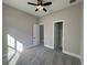 Bedroom with gray carpet, ceiling fan and closet at 547 Sanctuary Golf Pl, Apopka, FL 32712
