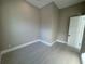Spacious bedroom with neutral walls and gray tile floors at 547 Sanctuary Golf Pl, Apopka, FL 32712