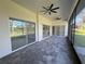 Spacious screened lanai with tiled floor and multiple ceiling fans at 547 Sanctuary Golf Pl, Apopka, FL 32712