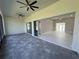 Covered lanai with tiled flooring and sliding glass doors leading to the backyard at 547 Sanctuary Golf Pl, Apopka, FL 32712
