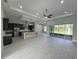 Open living area with high ceilings and kitchen views at 547 Sanctuary Golf Pl, Apopka, FL 32712
