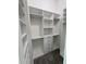 Spacious walk-in closet with white shelves, drawers, and hanging rods at 547 Sanctuary Golf Pl, Apopka, FL 32712